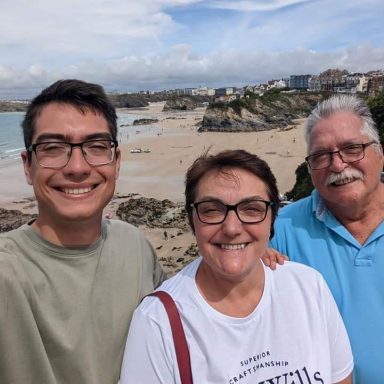 Family of 3 at Cornwall Beach, England Family of 3 at Cornwall Beach, England